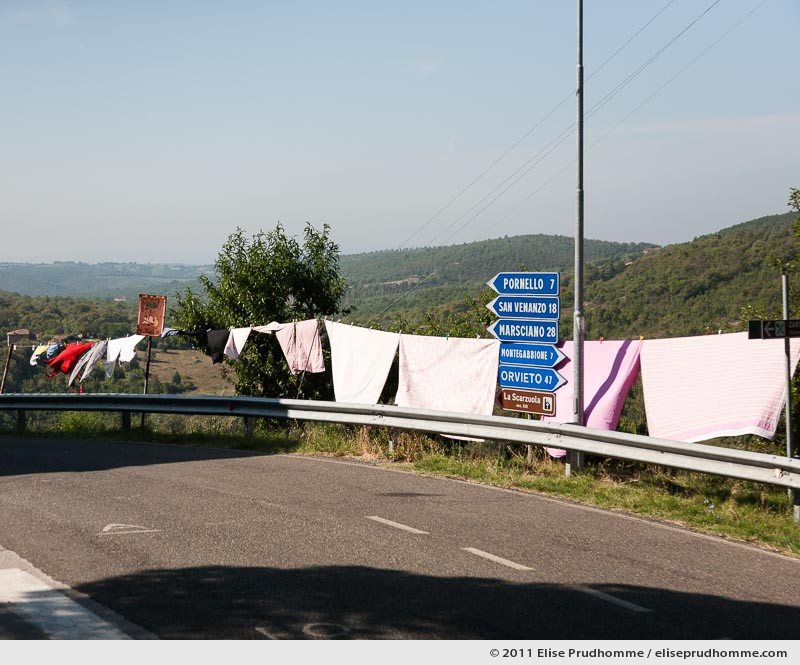 Laundry hung to dry along the roadside, Montegiove, Italy, 2011 by Elise Prudhomme