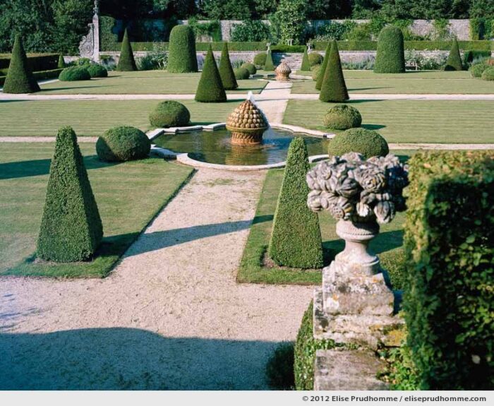 Artichoke fountains and topiary, Brecy Castle Gardens, Saint Gabriel Brécy, France, 2012 (series Notable Gardens of France) by Elise Prudhomme.