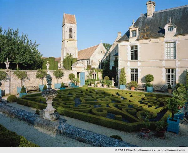 Late afternoon view of the church and château from the first terrace, Brécy Castle Gardens, Saint Gabriel Brécy, France, 2012 (series Notable Gardens of France) by Elise Prudhomme.
