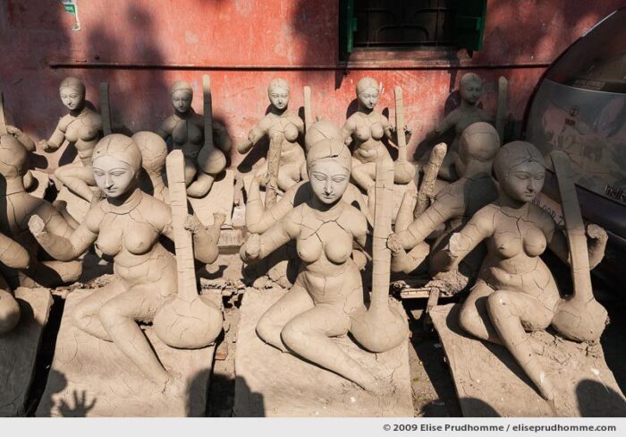 Partly-completed clay puja effigies of Goddess Saraswati in the Kumartuli district sculptor’s enclave, Kolkata, Calcutta, West Bengal, India