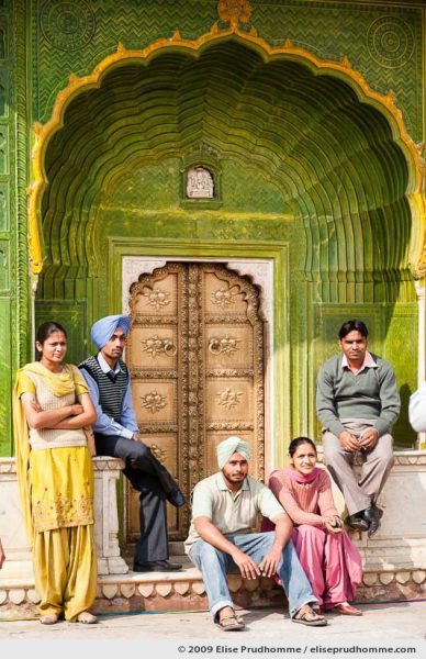 Indian family posing in front of the ornate peacock doorway, Chandra Mahal, Jaipur City Palace Complex, Rajasthan, India, 2009 by Elise Prudhomme.