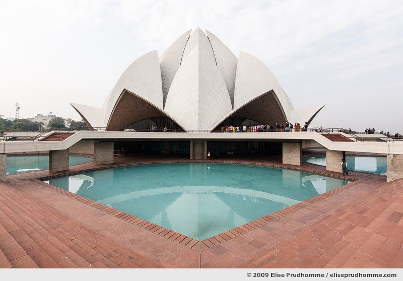 Lotus Temple and decorative pool under cloudy skies, New Delhi, India, 2009 by Elise Prudhomme.