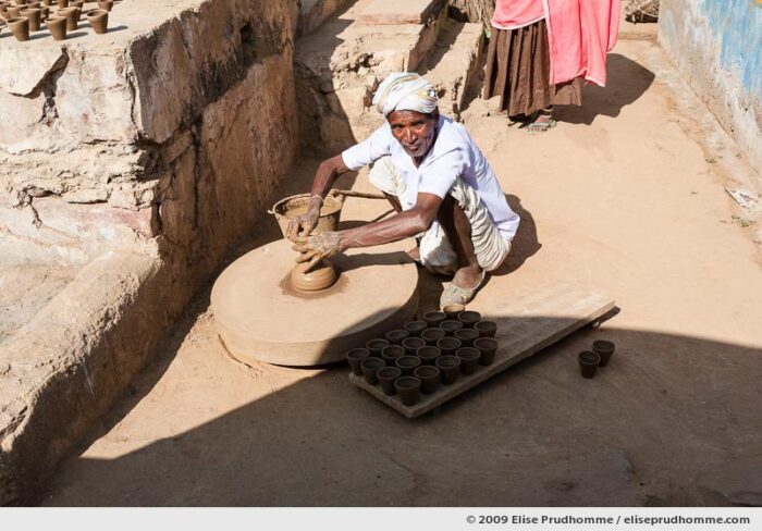 Potter making clay pots on a wheel, Abhaneri, Rajasthan, India, 2009 by Elise Prudhomme.