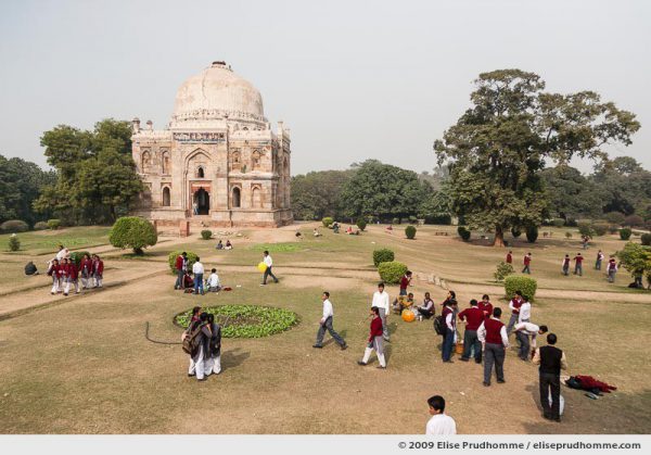 School students relaxing in front of Shisha Gumbad, Lodi Gardens, Delhi, India, 2009 by Elise Prudhomme