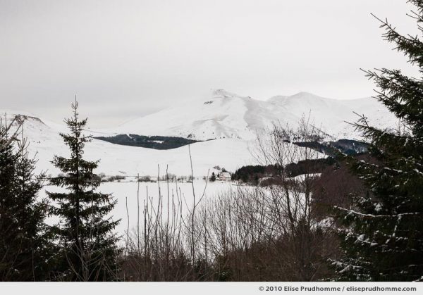 Snow-covered Lake Guéry from cross-country ski trails above, Banne d'Ordanche, Auvergne, France
