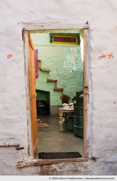 Traditionally painted mud wall and doorway of a home in the fort of Jaisalmer, Rajasthan, Western India, 2009 by Elise Prudhomme.
