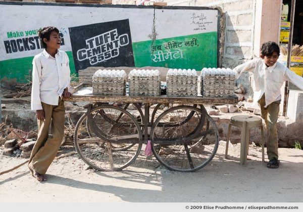 Two teenage boys selling eggs on a street trolley in Rohet village, Rajasthan, Jodphur, India, 2009 by Elise Prudhomme.
