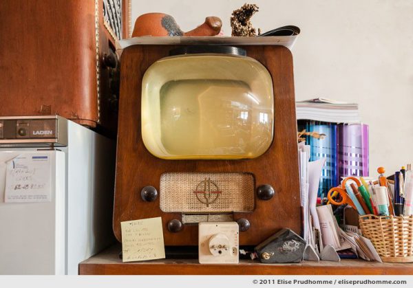 Vintage television set and other paraphernalia on a storage shelf, Clermont-Ferrand, France, 2011 by Elise Prudhomme.
