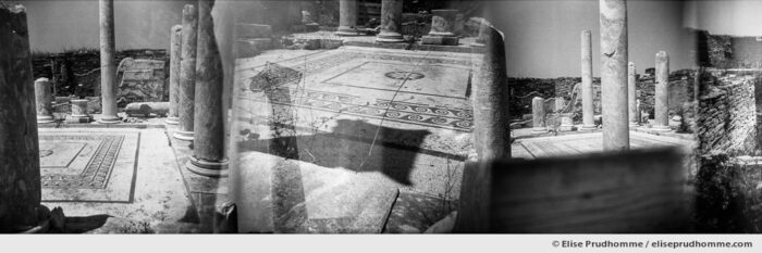 Black and white photograph of the ruins of Delos, Greece. Analog photography series entitled Lieux-dits by Elise Prudhomme.