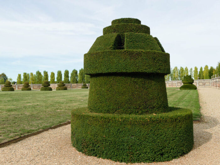 Topiary garden at the Chateau du Champ de Bataille, Normandy, France, designed to represent a game of chess. This chess piece is the castle, or rook.