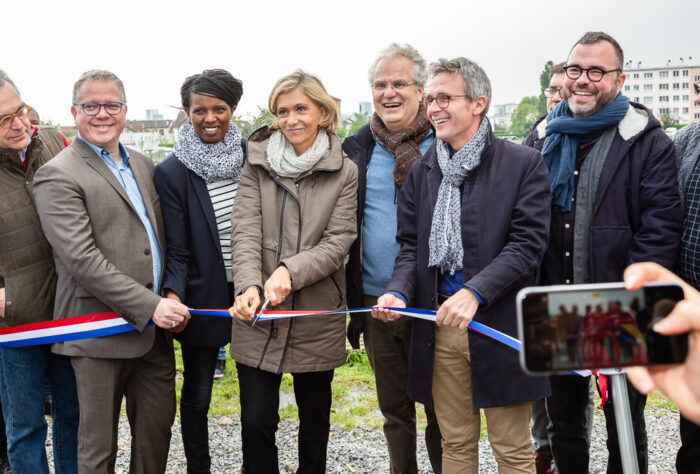 President of the IDF region (Valérie Pécresse) cuts the ribbon to inaugurate the Urban Farm of Saint-Denis with Saint-Denis Mayor (Laurent Russier - holding ribbon left) and President of the Seine-Saint-Denis Departmental Council President (Stéphane Troussel - holding ribbon right).
