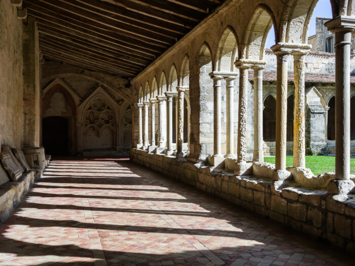 Interior cloister, columns and walls of the Eglise Collegiale in Saint-Emilion, Bordeaux region, Department of the Gironde, France.