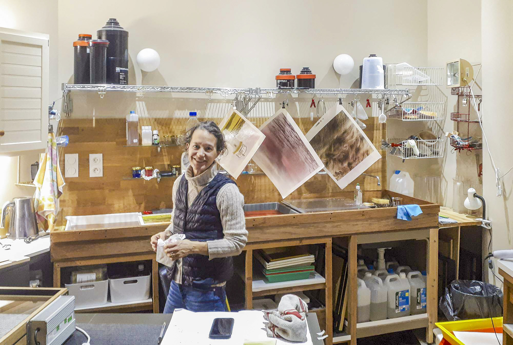 Elise Prudhomme working on quad-chrome prints in her laboratory.