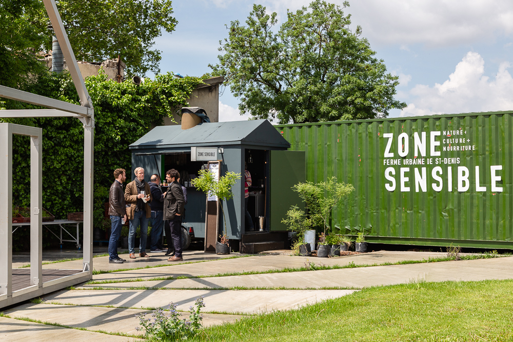 Entrance to the Sensitive Zone project and bar - teahouse - kiosk, Seine-Saint-Denis.  L'inauguration de la Ferme Urbaine de Saint-Denis le 11 mai 2019.  Zone Sensible / Parti Poétique et la Ferme Ouverte de Saint-Denis.