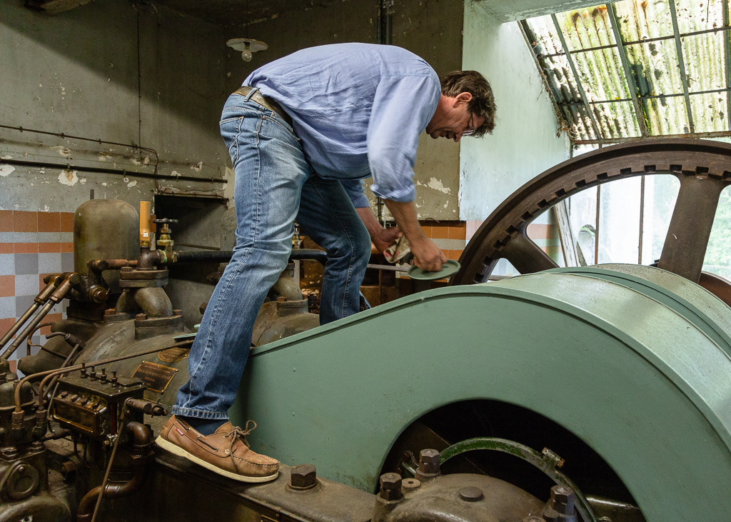 Benoit Lechevallier starting the Ruston & Hornsby motor of Saint Gabriel Flour Mill.  Restoration of the Saint-Gabriel Flour Mill, Saint-Gabriel-Brecy, France.
