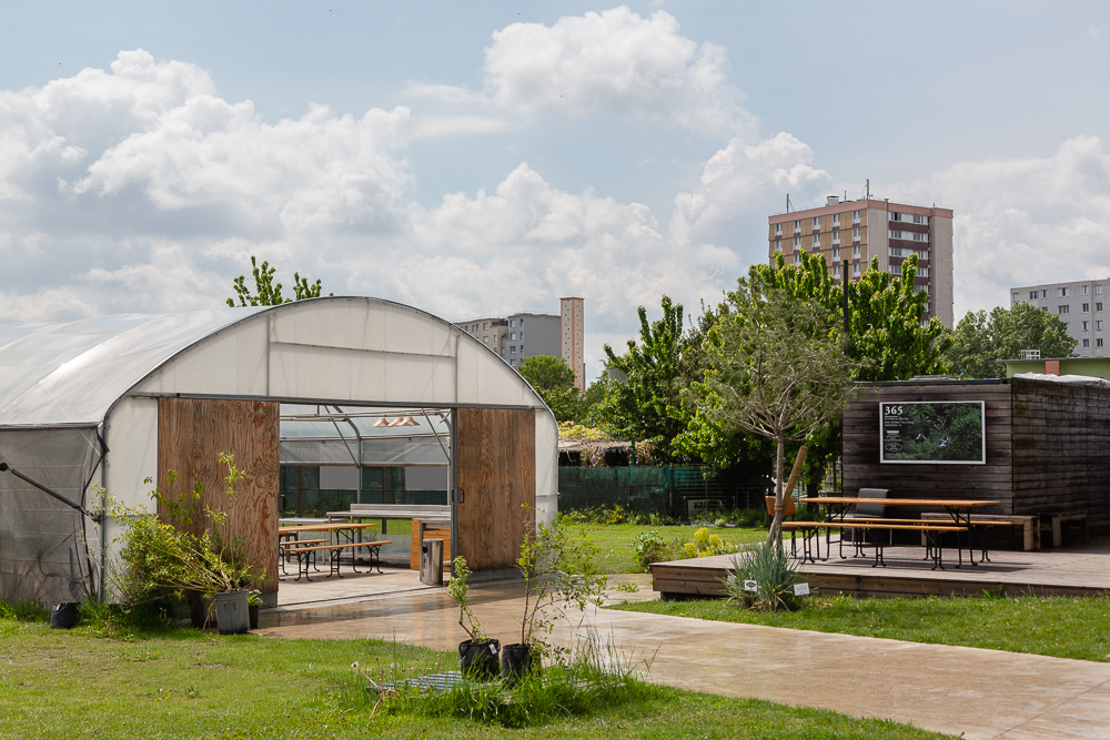 Overview of the greenhouse and public areas of the Sensitive Zone, Seine-Saint-Denis.  L'inauguration de la Ferme Urbaine de Saint-Denis le 11 mai 2019.  Zone Sensible / Parti Poétique et la Ferme Ouverte de Saint-Denis.