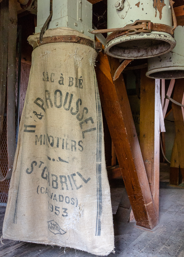Sack of flour and shafts at the Saint Gabriel Mill.  Restoration of the Saint-Gabriel Flour Mill, Saint-Gabriel-Brecy, France.