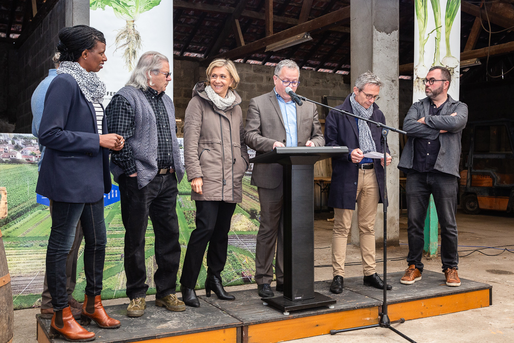 IDF Regional President Valérie Pécresse speaks with René Kersanté (to her left) during a speech given by Mayor Laurent Russier at the official inauguration on May 11, 2019.  L'inauguration de la Ferme Urbaine de Saint-Denis le 11 mai 2019.  Zone Sensible / Parti Poétique et la Ferme Ouverte de Saint-Denis.