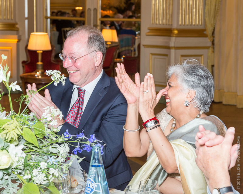 Guests cheering the bride's speech during the wedding reception at the Cercle de l'Union Interalliée, Paris, France.