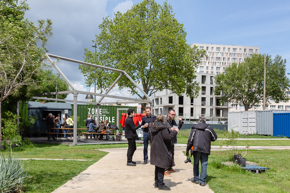 Overview of the greenhouse and public areas of the Sensitive Zone, Seine-Saint-Denis.  L'inauguration de la Ferme Urbaine de Saint-Denis le 11 mai 2019.  Zone Sensible / Parti Poétique et la Ferme Ouverte de Saint-Denis.